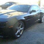 Photographs of a 2014 Chevrolet Camaro that was in an accident and repaired by Elite Paint & Body Shop in West Palm Beach Florida